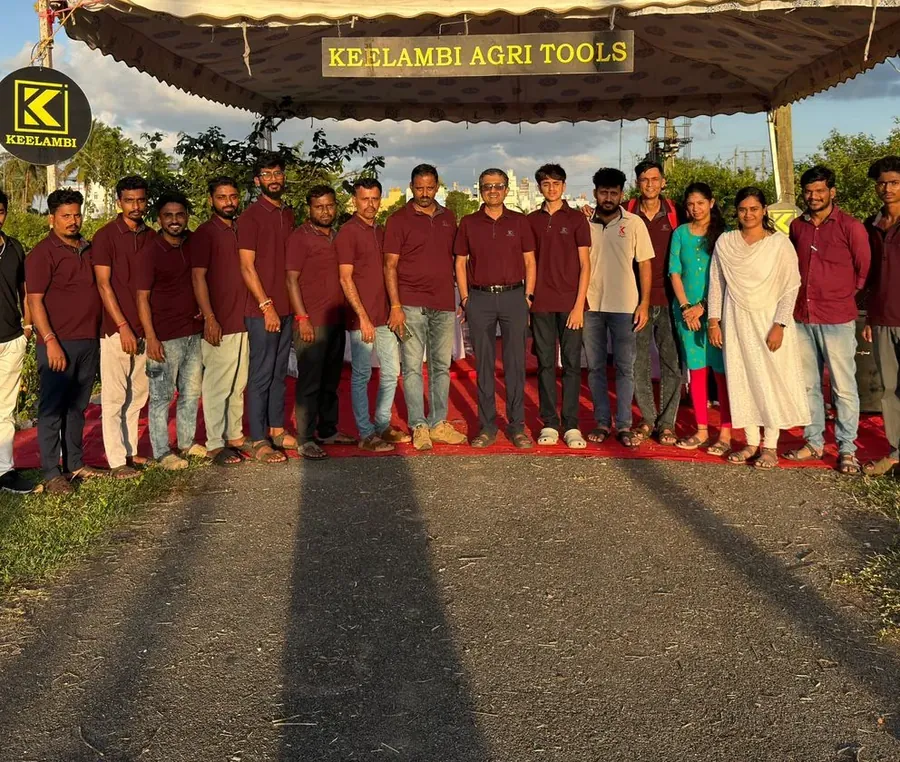The Keelambi team lined up in maroon polos under the Keelambi Agri Tools marquee at sunset