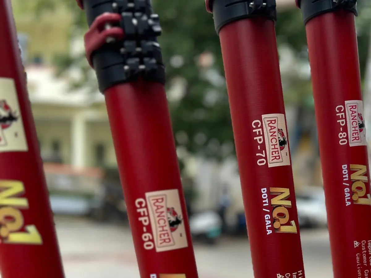 Rancher Doti poles standing side by side with the grade codes CFP-60, CFP-70 and CFP-80 printed on each red shaft